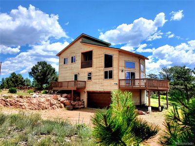 Cedar sided mountain home with incredible views on 20 acres, rider on well allows for horses | Image 1