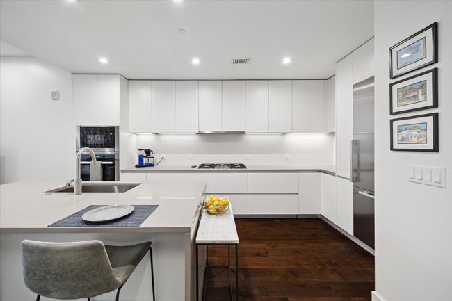 Chefs kitchen with state of the art appliances and large kitchen island | Image 4