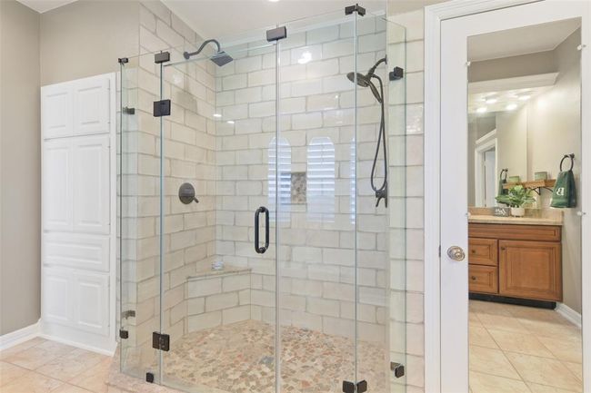 Updated shower with dual shower heads. Bathroom has great storage! | Image 26