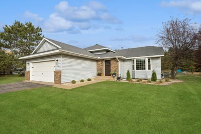 Great curb appeal with new landscaping including shrubs and rock around the home. The sellers also added hydro seed for the last couple years to really bring the yard back to life. | Image 2