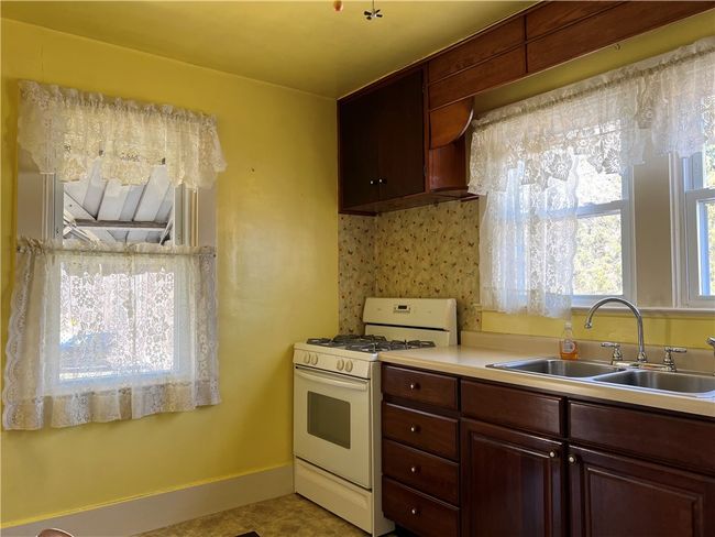 Another angle view of kitchen. | Image 7