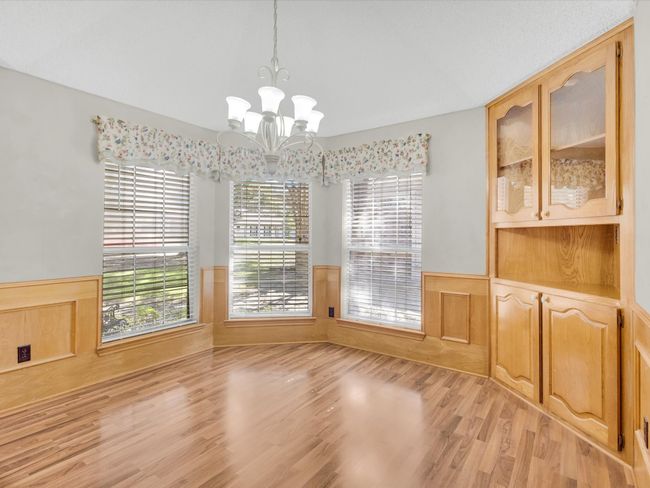 Large Dining Area in kitchen has built-ins and large windows for lots of natural light. | Image 20