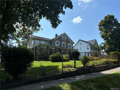 View of front facade featuring a porch | Image 1