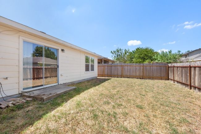 View of fenced backyard | Image 27