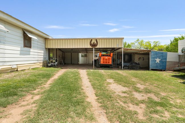 View of yard with driveway and a carport | Image 27