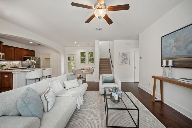 Whether you're curled up with a book or hosting a lively dinner, the living room's relaxed atmosphere and connection to the greenbelt ensure every moment spent here feels peaceful and welcoming | Image 10