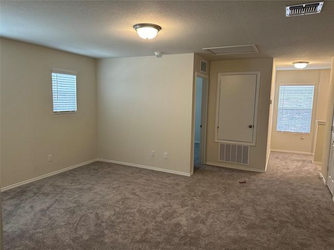 Empty room with carpet flooring and a textured ceiling | Image 12
