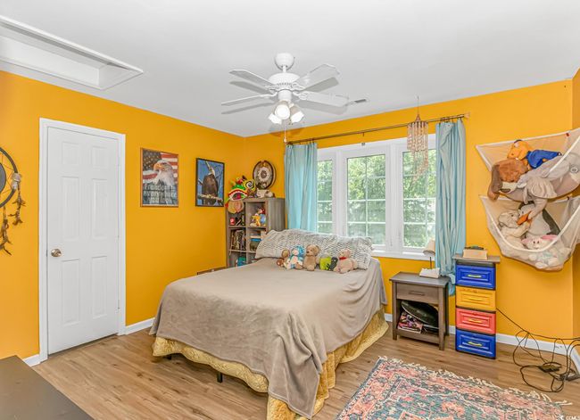 Bedroom featuring wood finished floors and a ceiling fan | Image 23