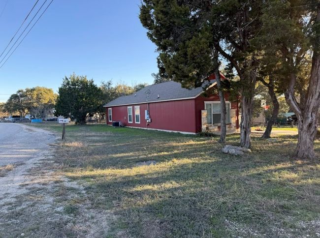 Side view of property exterior featuring. | Image 30