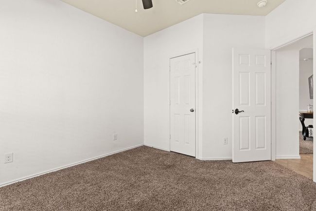 Unfurnished bedroom featuring carpet flooring and ceiling fan | Image 19