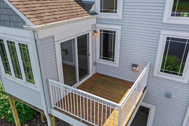 The deck off the sunroom on the main floor. | Image 49
