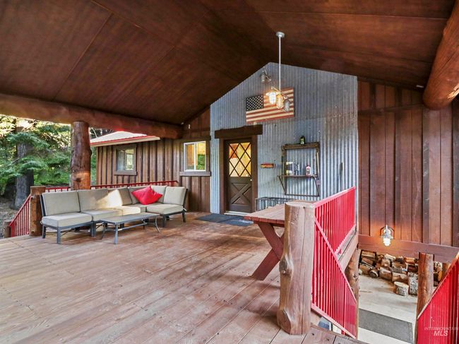 Wooden terrace with an outdoor hangout area | Image 46
