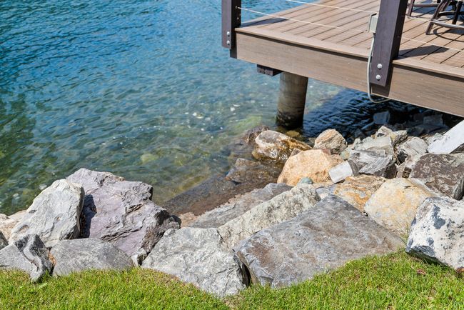 Stone stairs from yard into the lake | Image 50