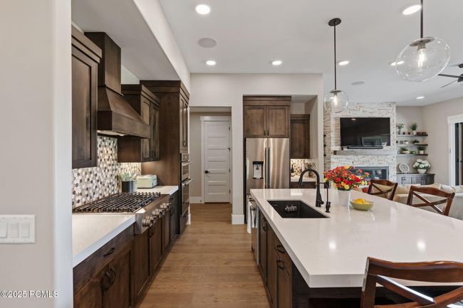 Kitchen view to pantry, laundry and garage entry | Image 10