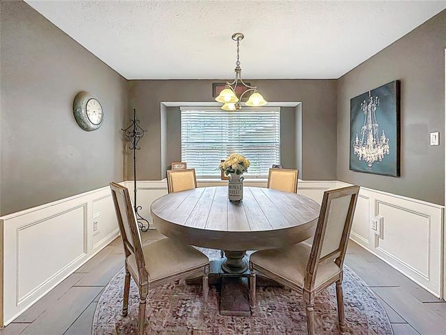 Inviting breakfast area is met with more natural light and easy access to the backyard. | Image 9