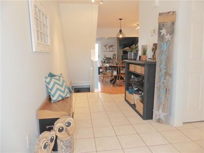 Big coat closet, interior entrance and powder room to the right. | Image 3