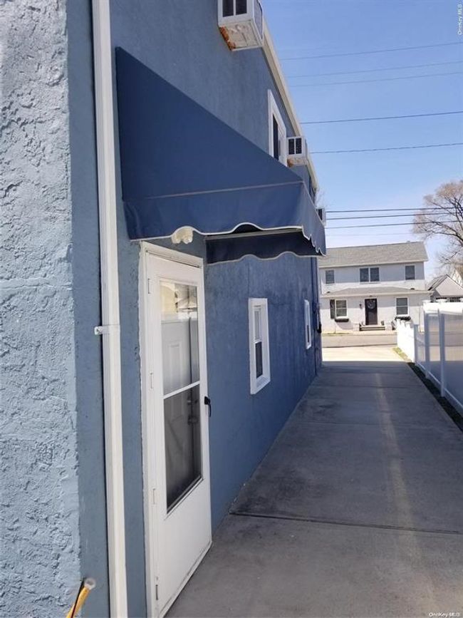 View of home's exterior featuring stucco siding | Image 4