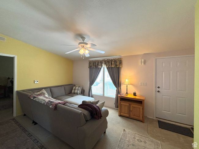Living room featuring a ceiling fan | Image 20