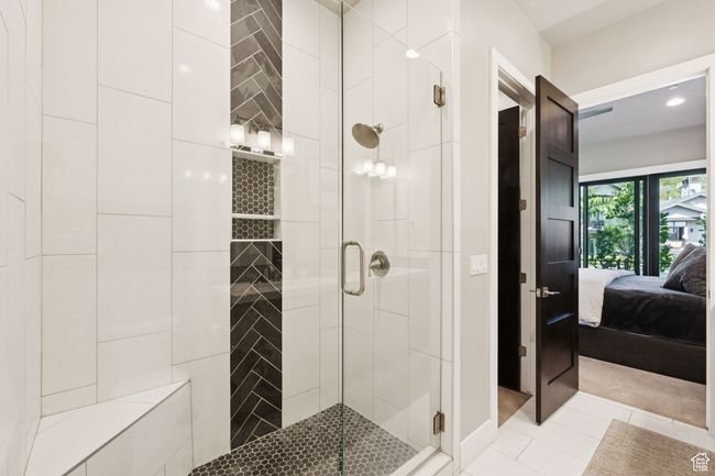 Bathroom with ensuite bath, a shower stall, and tile patterned flooring | Image 25