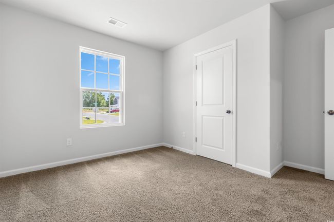 Unfurnished bedroom featuring carpet floors | Image 8