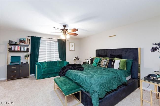 Carpeted bedroom featuring a ceiling fan | Image 21