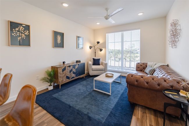 Living room with ceiling fan, baseboards, wood finished floors, and recessed lighting | Image 8