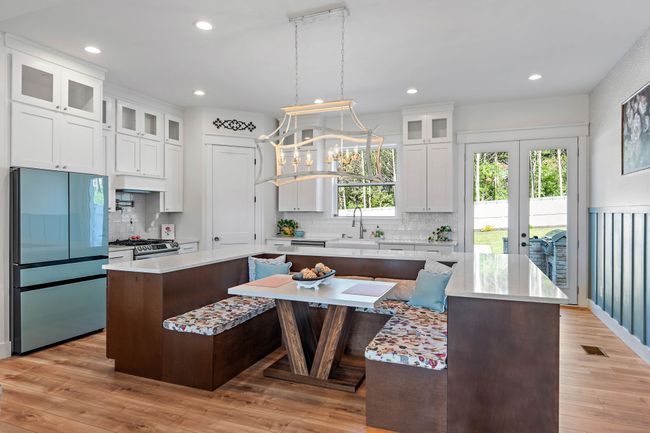 Custom kitchen island that doubles as an additional eating area. | Image 10