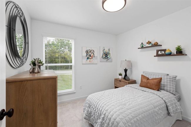 Bedroom featuring light colored carpet | Image 13