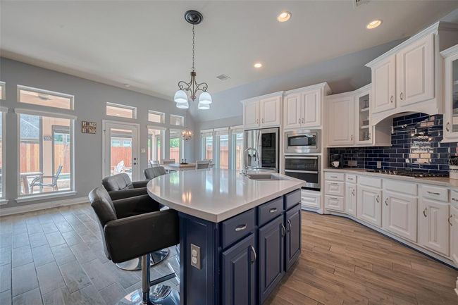 This kitchen offers plenty of space to move around freely, making cooking and entertaining a breeze. | Image 21