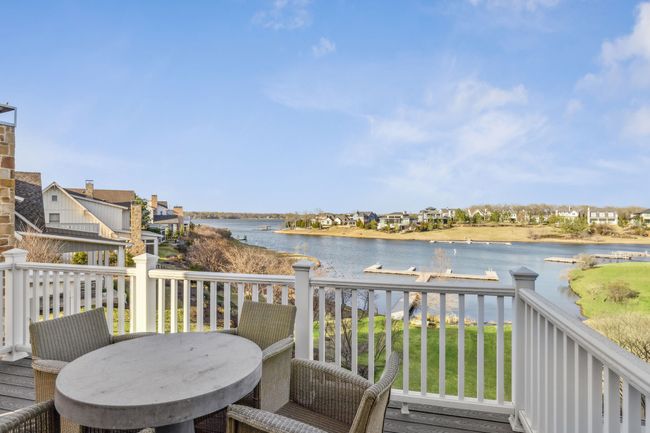 Wooden terrace featuring a water view and outdoor dining space | Image 23