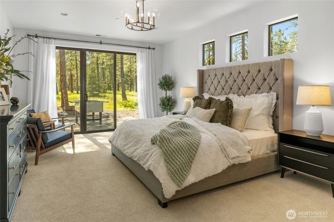 Primary bedroom with sliding glass to outdoor patio. | Image 22