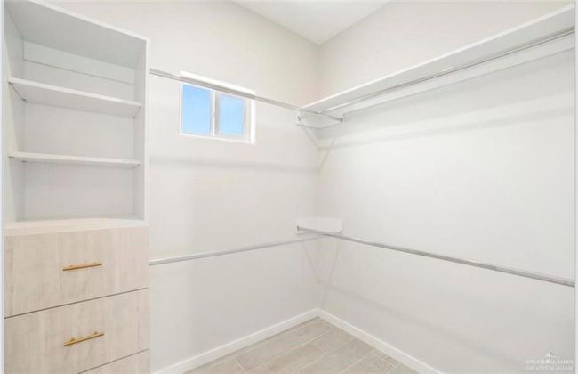 View of walk in closet | Image 9