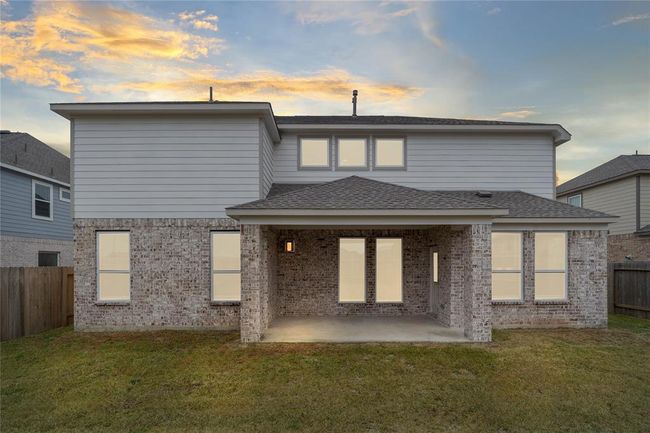 Come and see this spacious backyard with beautiful covered patio!! There is plenty of room for the kids to play and adults to relax! Perfect for your outdoor living space, patio furniture, bbq pit, and so much more! The possibilities are endless! | Image 22