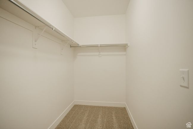 Walk in closet featuring carpet flooring | Image 20