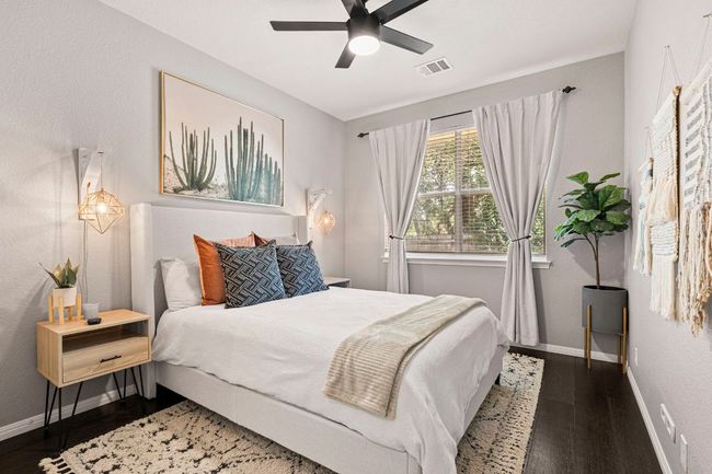 Inviting guest room with ample natural light | Image 13