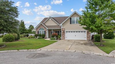 View of front facade featuring a garage and a front lawn | Image 2