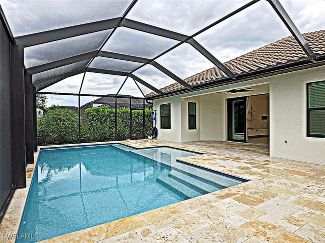 Outdoor pool featuring ceiling fan and a patio area | Image 31