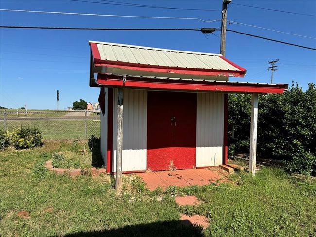 View of shed / structure with a yard | Image 9