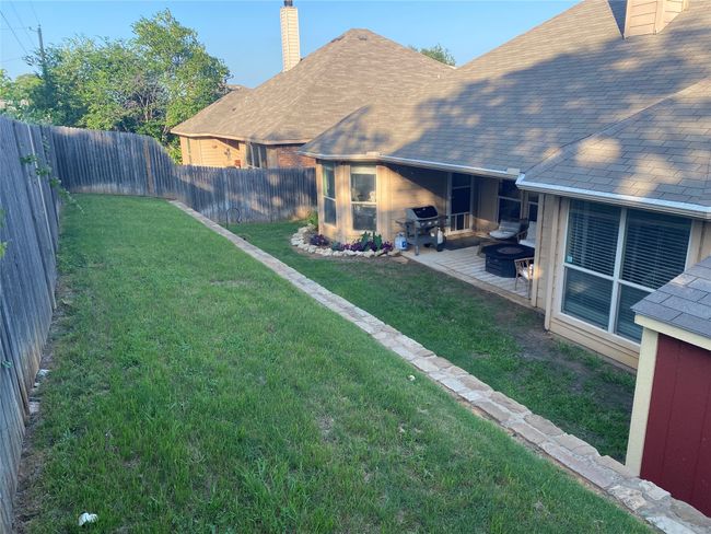 View of yard with a patio area and a fenced backyard | Image 4