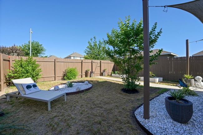 View of yard featuring a fenced backyard | Image 38