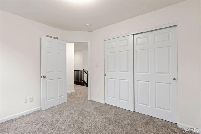 Unfurnished bedroom with carpet flooring and a closet | Image 22