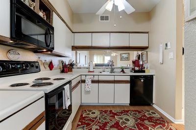 View from kitchen to dining area.Lots of counter space. | Image 2