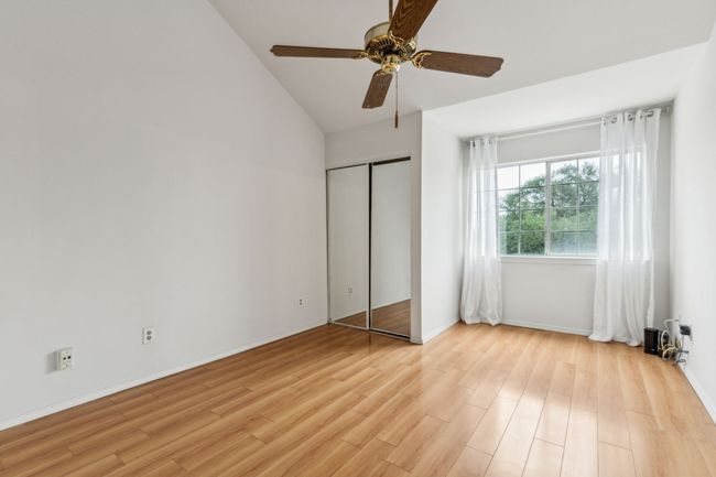 Beautiful wood flooring, ceiling fan and large window. There are also 2 large closets in this space | Image 20