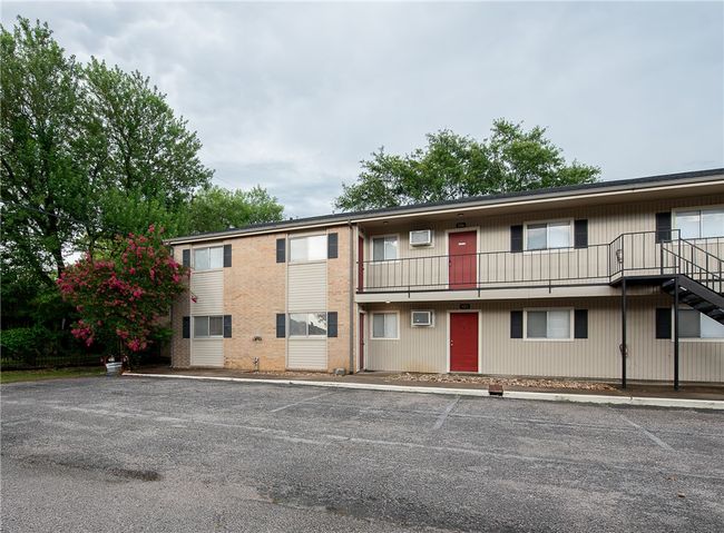 View of property featuring uncovered parking | Image 10