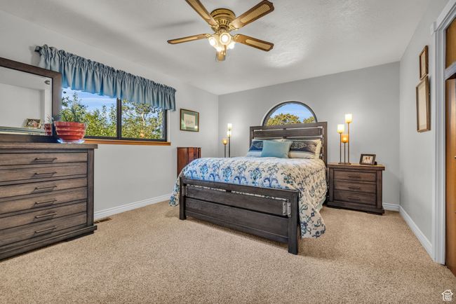 Master Bedroom 1. Carpeted bedroom featuring baseboards and a ceiling fan | Image 13
