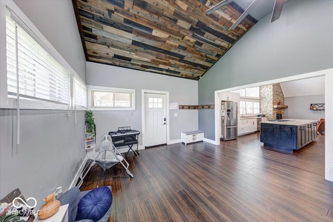 living room opens into the kitchen | Image 18