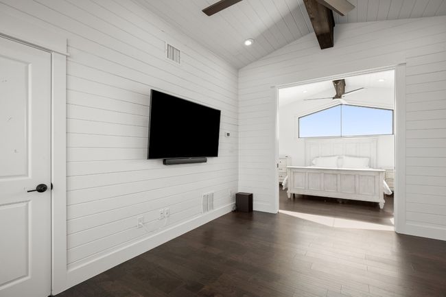 A view of the upstairs additional guest room from bonus space. | Image 23