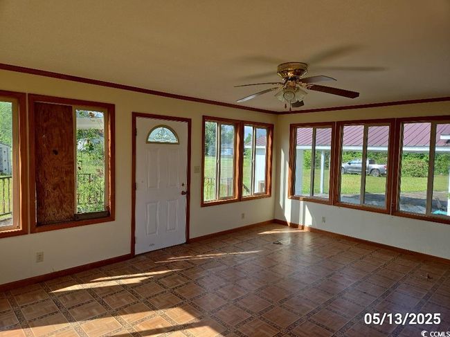 Entrance foyer with healthy amount of natural light, a ceiling fan, and baseboards | Image 27