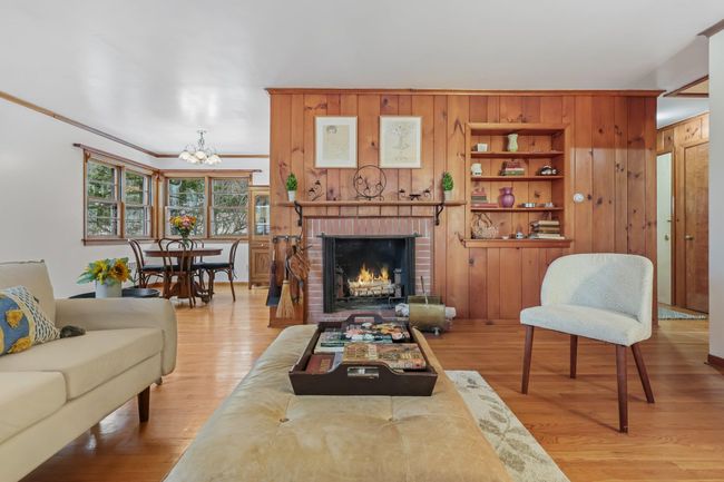 Living room with Fireplace, view of dining area and built-ins | Image 12