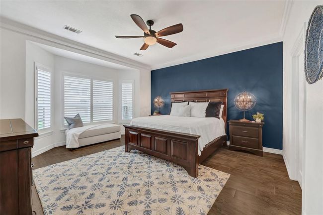 Beautiful bay window in primary suite, complete with plantation shutters. | Image 18